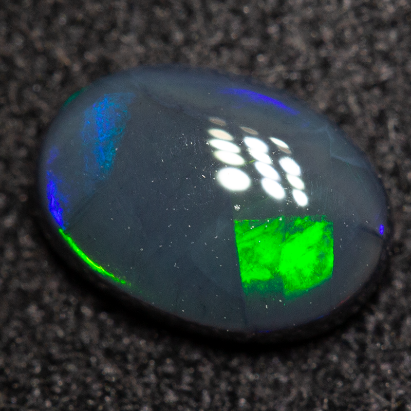 0.60 ct black opal 6.8x4.8x2.6mm