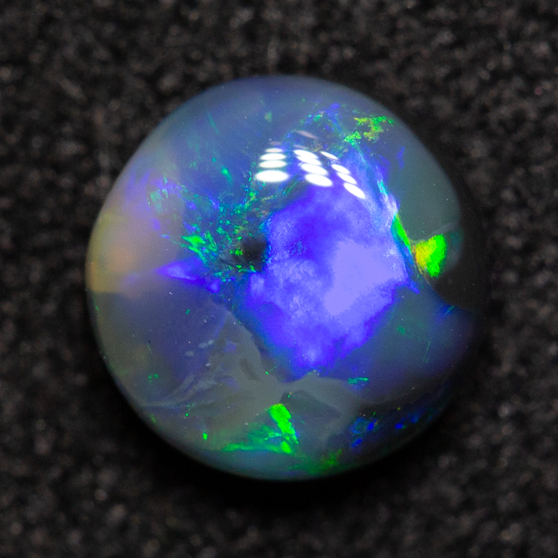 0.60 ct black opal 5.6x5.6x2.7mm