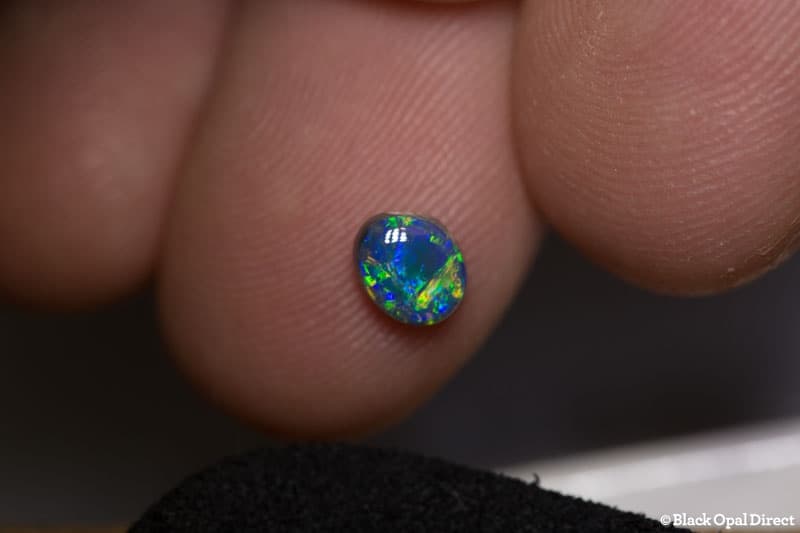 0.61 ct black opal 6.8x5.8x3mm