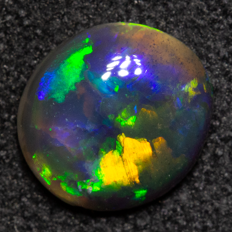 0.62 ct black opal 6.9x6.4x2.4mm