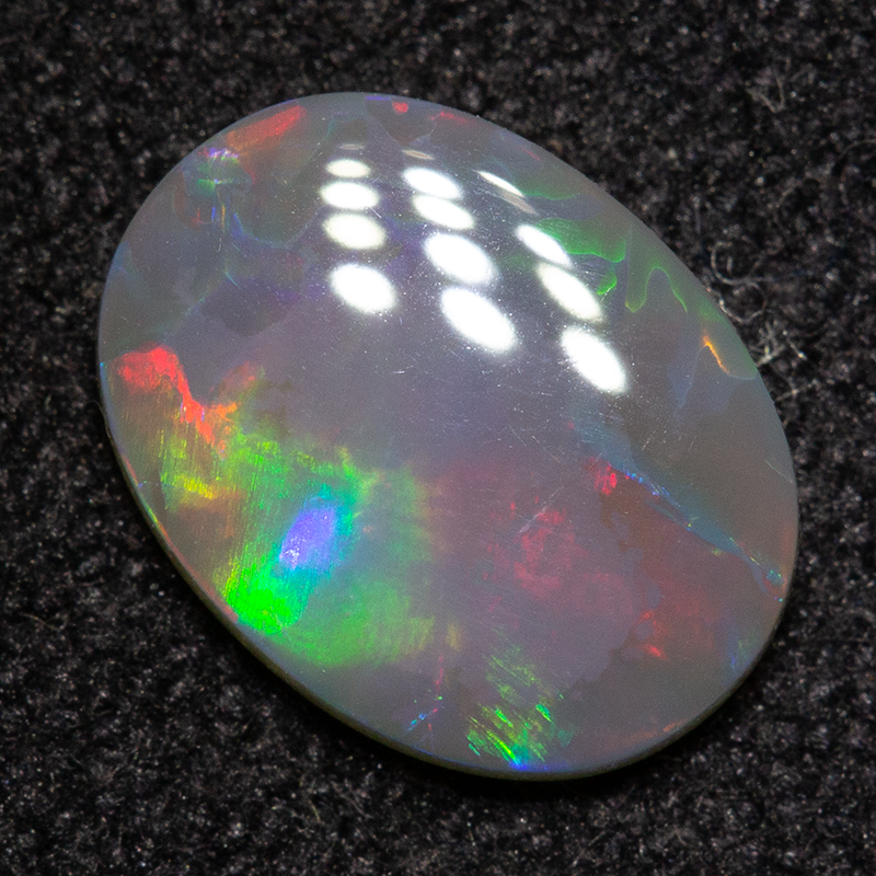 0.62 ct dark opal 8.4x6.3x1.7mm