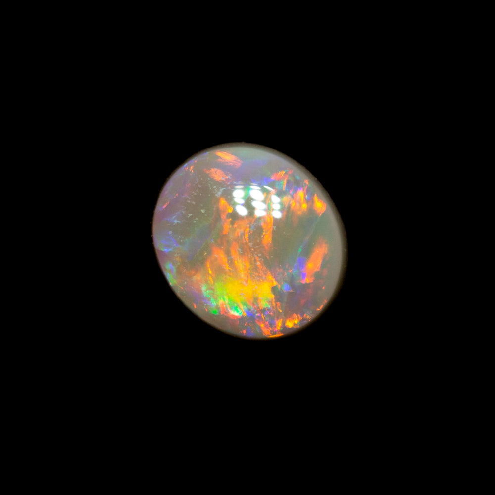 0.62 ct dark opal 5.9x5.1x3mm