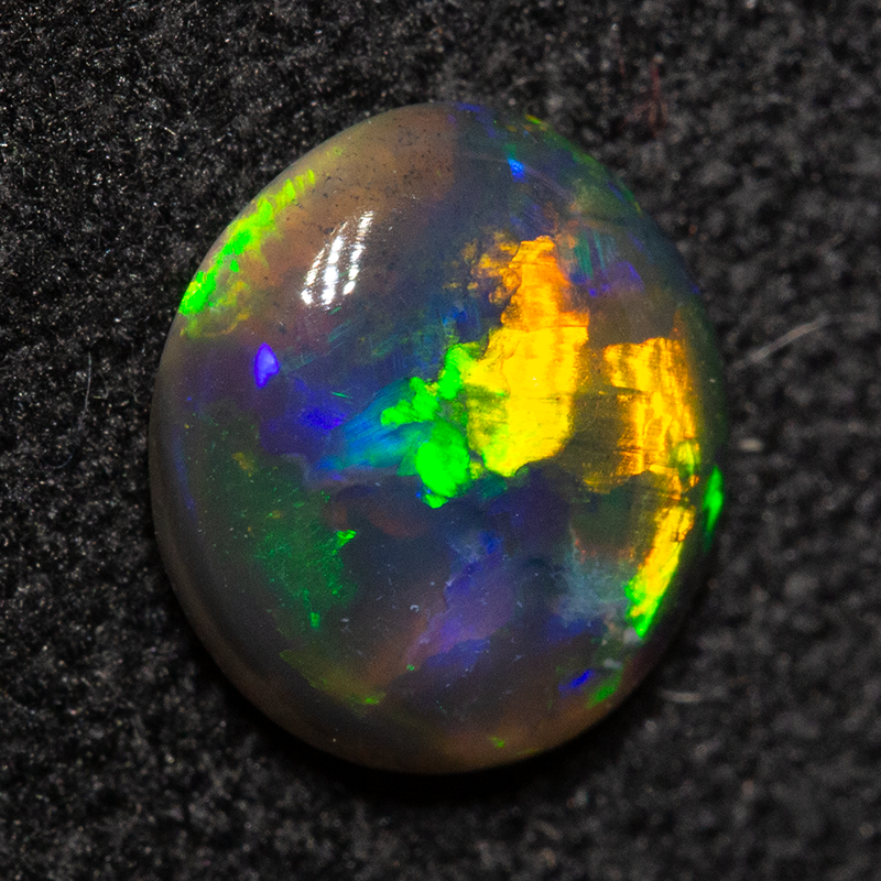 0.62 ct black opal 6.9x6.4x2.4mm