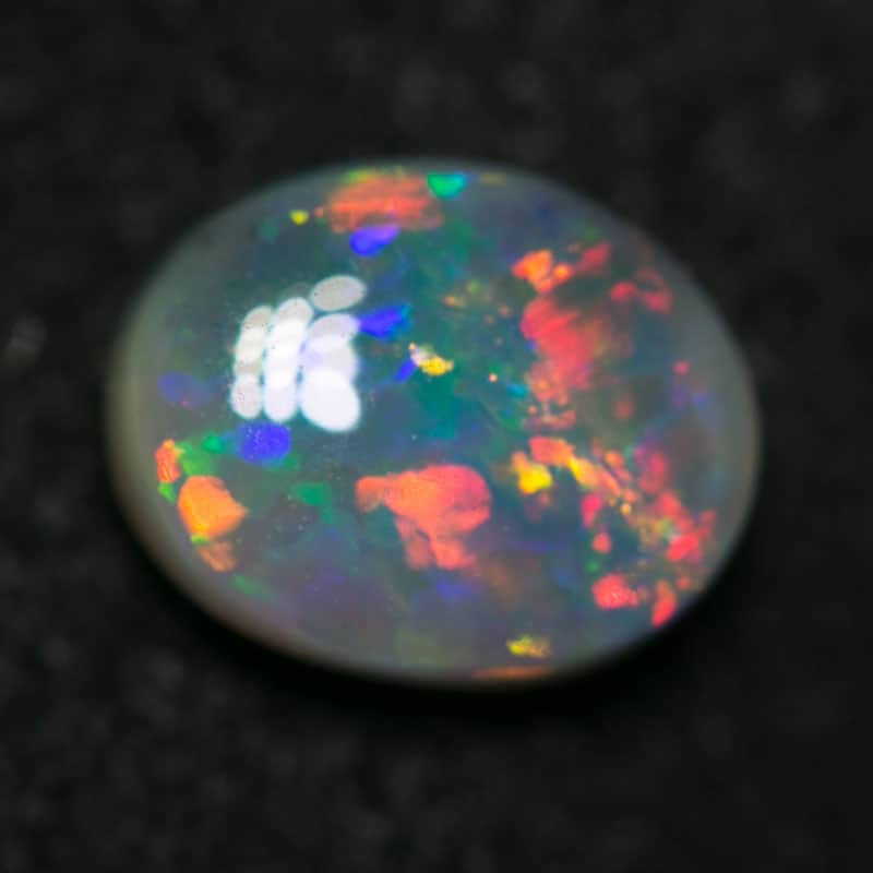 0.62 ct semi black opal 6.5x5x3mm