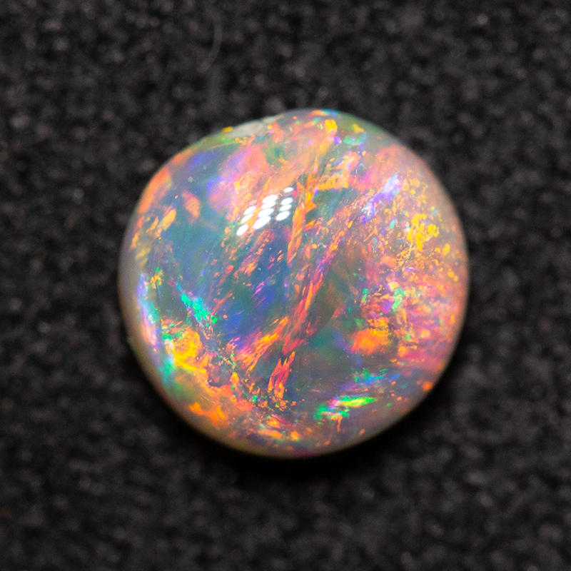0.63 ct dark opal 5.8x5.7x3mm