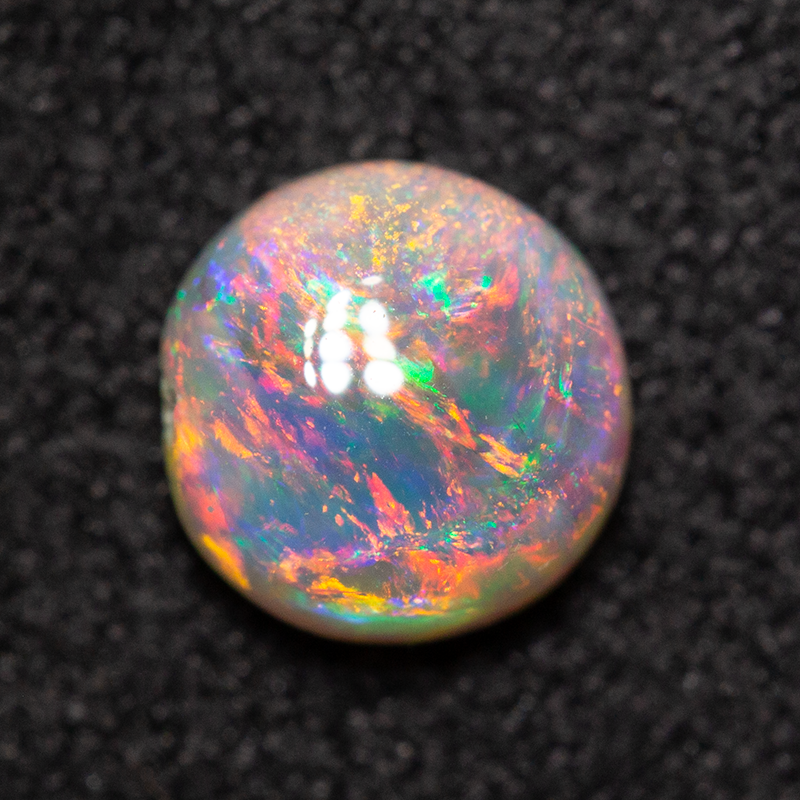 0.63 ct dark opal 5.8x5.7x3mm