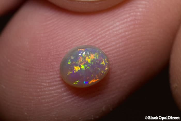 0.63 ct semi black opal 6.5x5x3mm