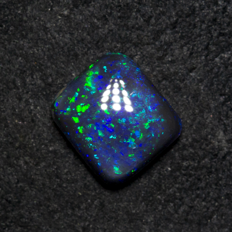 0.64 ct black opal 5.9x5.3x2.6mm