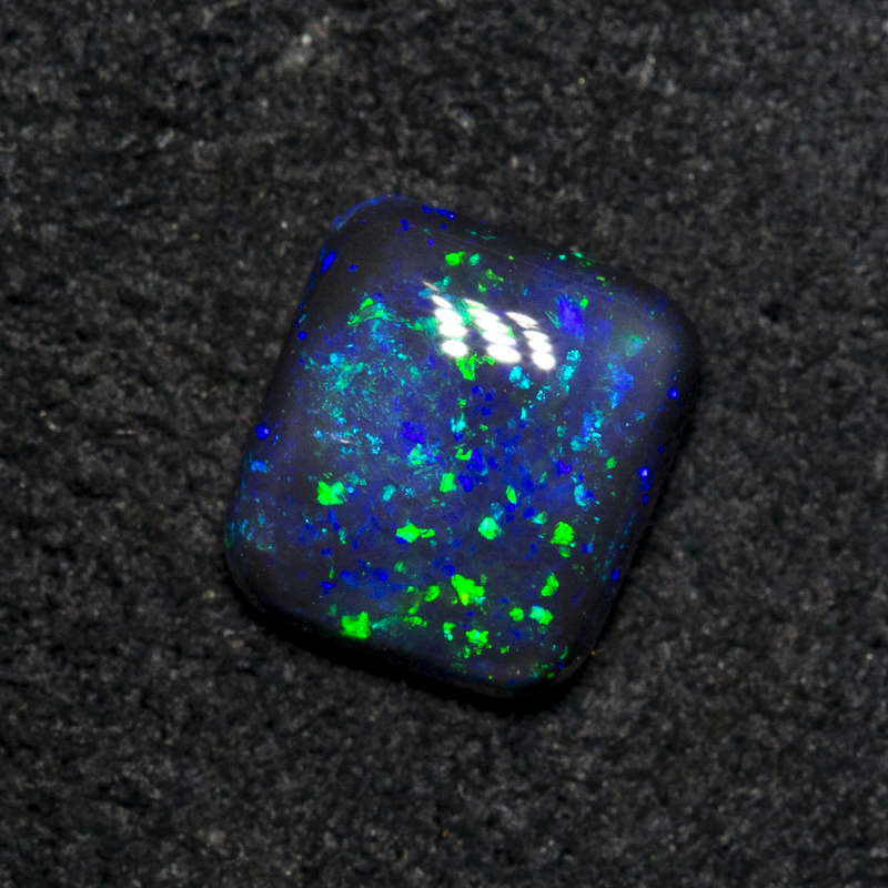 0.64 ct black opal 5.9x5.3x2.6mm
