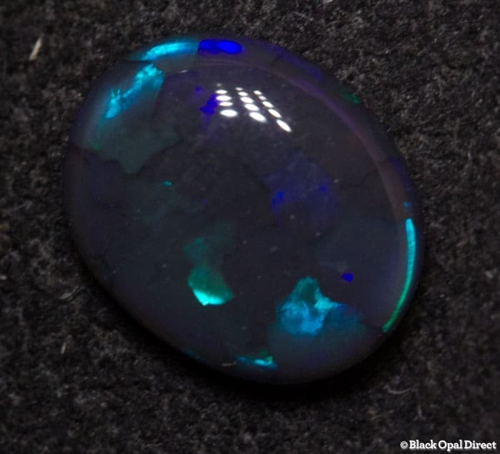 0.64 ct black opal 7x6x2mm