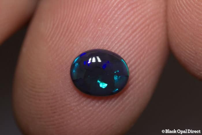 0.64 ct black opal 7x6x2mm
