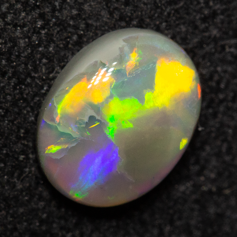 0.65 ct dark opal 6.9x5.3x2.5mm