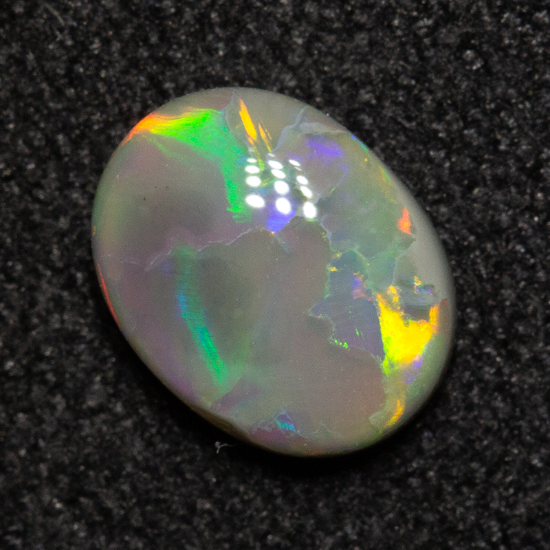0.65 ct dark opal 6.9x5.3x2.5mm