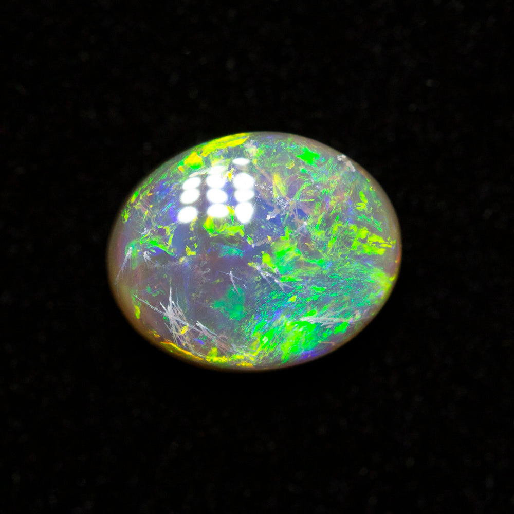 0.65 ct dark opal 6.5x5.3x2.9mm