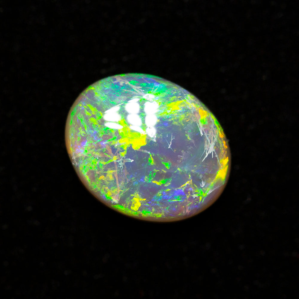 0.65 ct dark opal 6.5x5.3x2.9mm