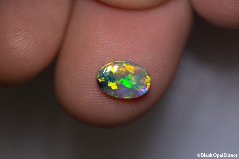 0.65 ct dark crystal opal 8x6x1.5mm