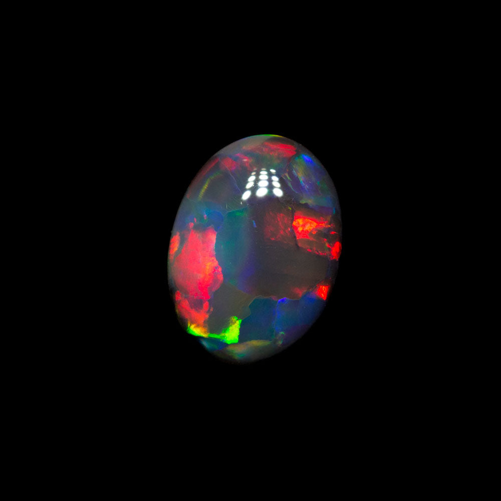 0.66 ct gem double-sided black opal 7.1x5.2x2.9mm