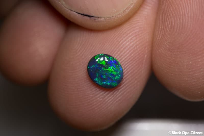 0.66 ct black opal 7x6x2mm