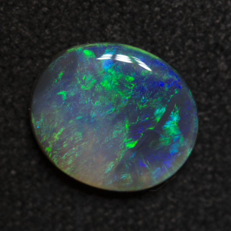0.67 ct black opal 7.6x6.5x1.8mm