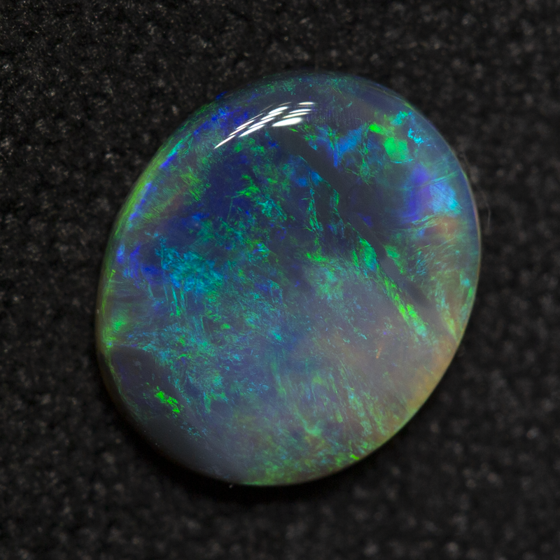0.67 ct black opal 7.6x6.5x1.8mm