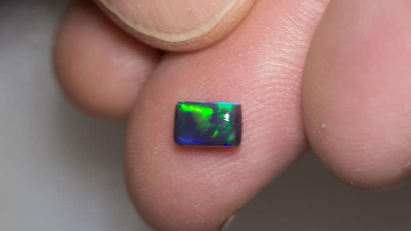 0.68 ct black opal pillow cut 6.5x4x2.5mm