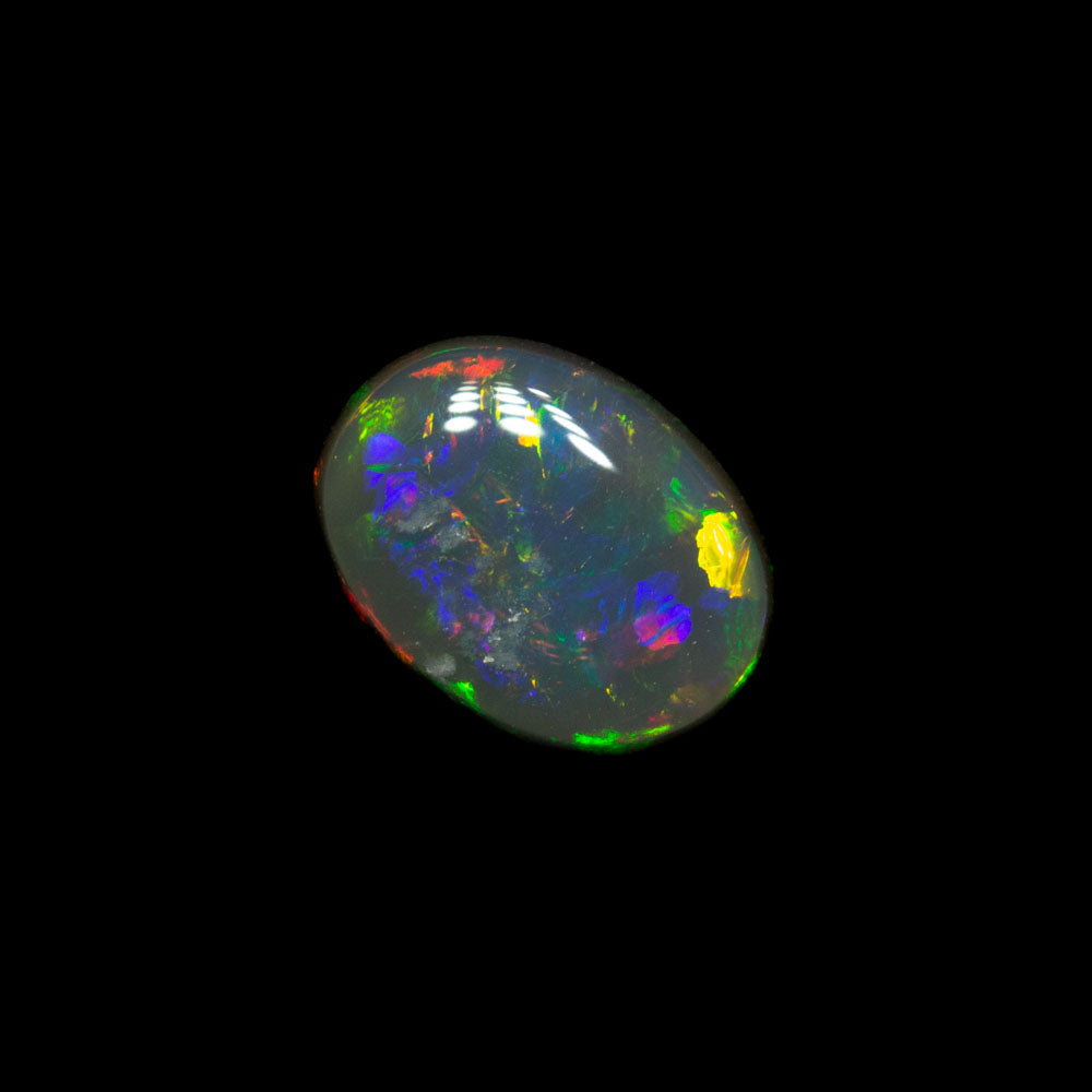 0.69 ct double-sided black opal 6.9x5.2x2.7mm