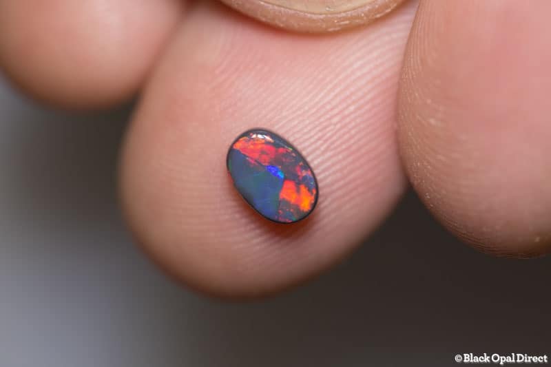 0.69 ct black opal 7x5x2.5mm
