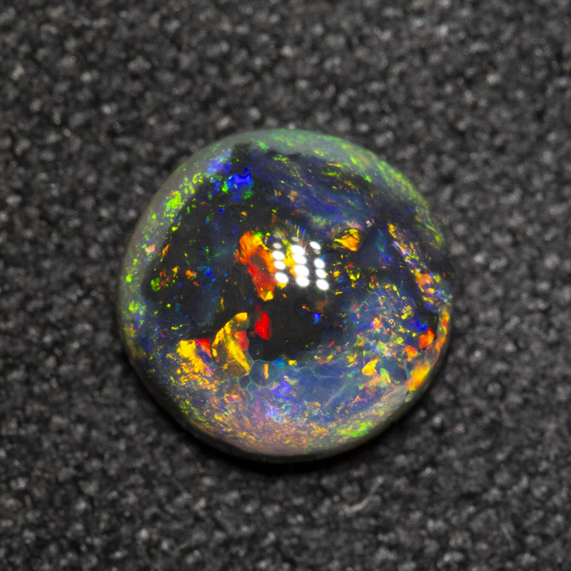 0.70 ct black opal 6.3x6.3x2.9mm