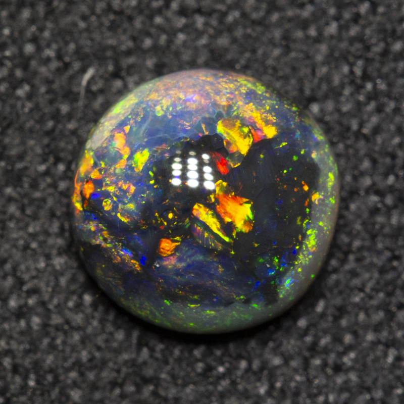 0.70 ct black opal 6.3x6.3x2.9mm