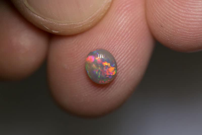 0.70 ct dark opal 6x5.5x3mm