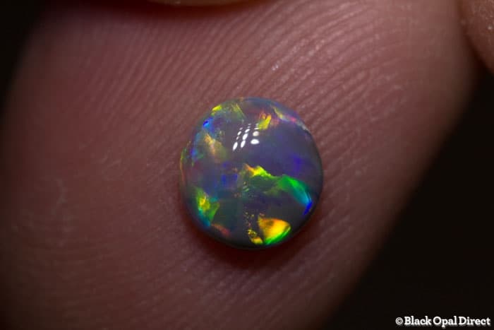0.71 ct semi black opal 7x6.5x3.5mm