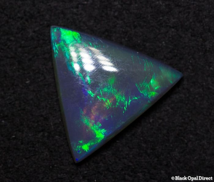 0.71 ct semi black opal triangle 8x8x2mm