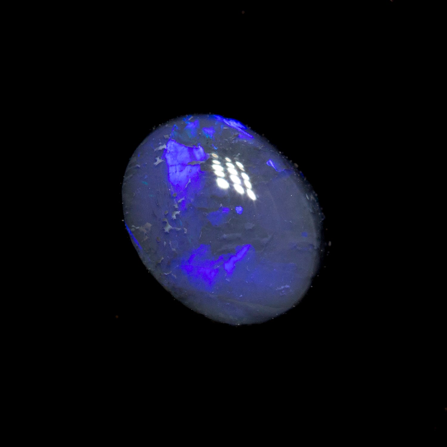 0.72 ct black opal 6.9x5.3x2.9mm