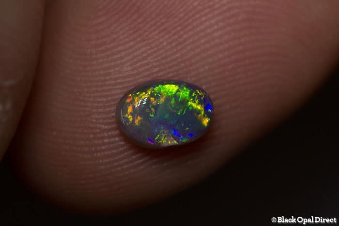 0.72 ct dark opal 7x5x3mm
