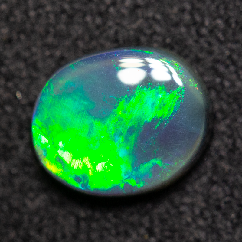 0.74 ct black opal 7x5.9x2.5mm
