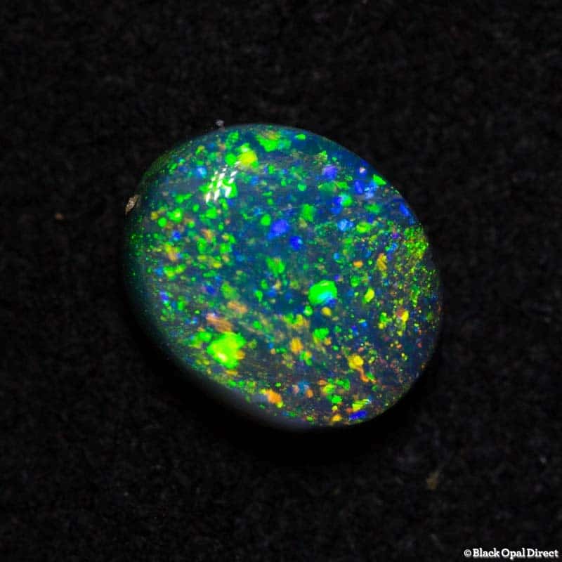 0.77 ct black opal pinfire pattern 6.4x5x3mm