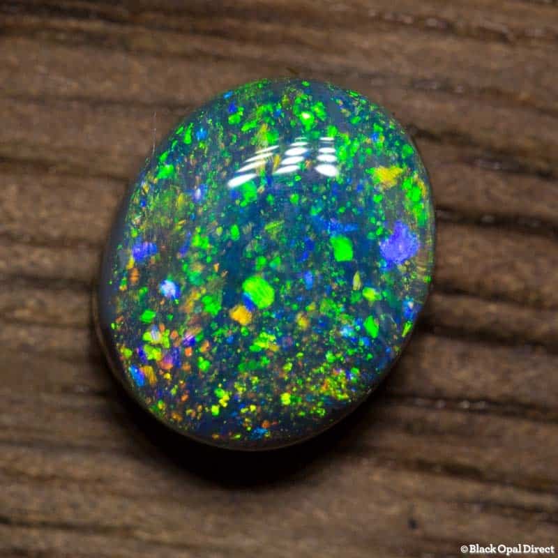 0.77 ct black opal pinfire pattern 6.4x5x3mm