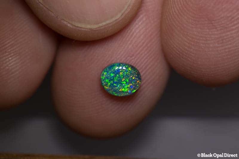 0.77 ct black opal pinfire pattern 6.4x5x3mm