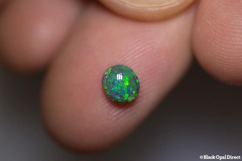 0.77 ct dark opal 6x5x3.5mm
