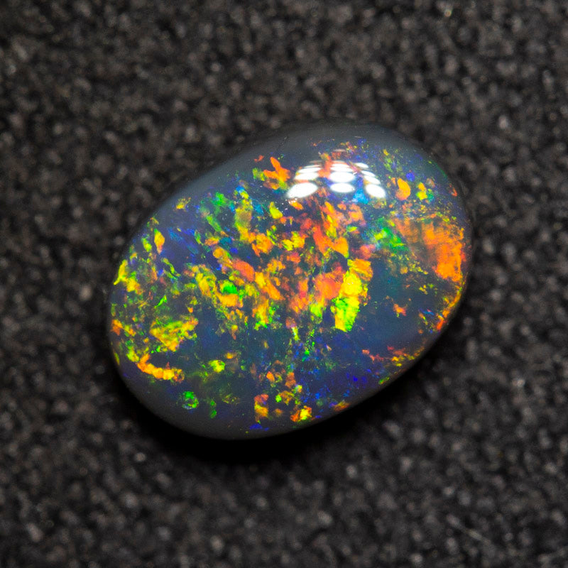 0.78 ct black opal 7.1x5.2x3mm