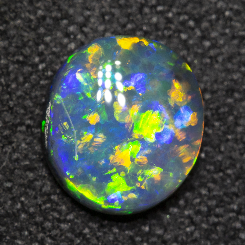 0.78 ct black opal 7x6.3x2.7mm
