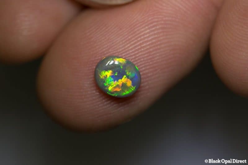 0.78 ct semi black opal 7x6x3mm