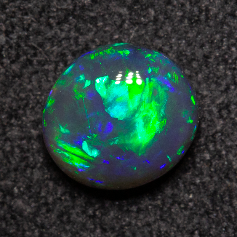 0.79 ct black opal 6.2x5.7x3.4mm