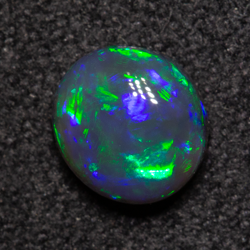 0.79 ct black opal 6.2x5.7x3.4mm