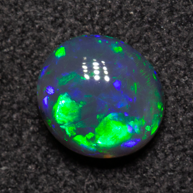 0.79 ct black opal 6.2x5.7x3.4mm