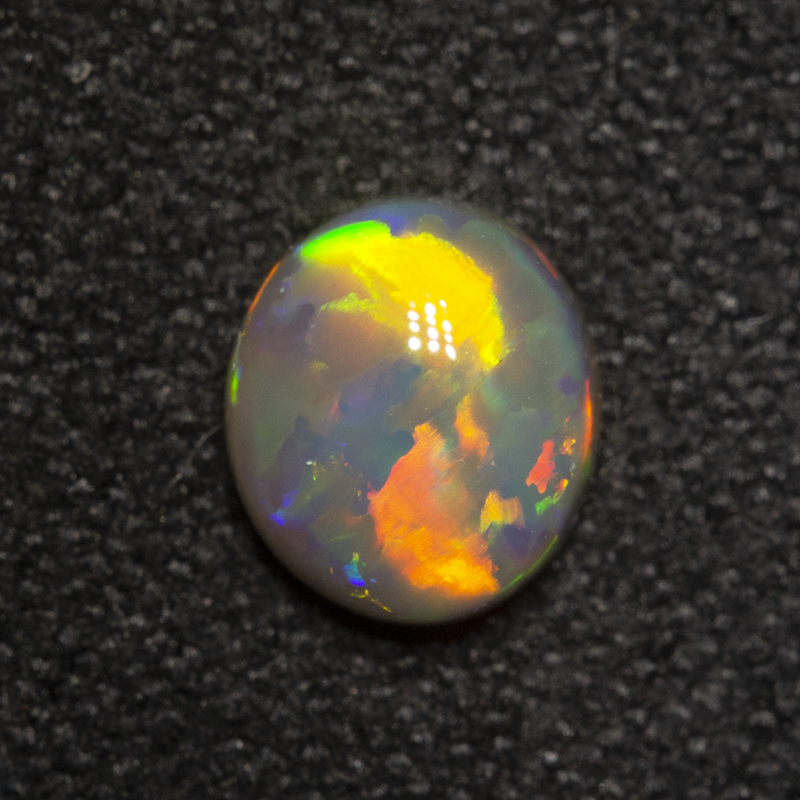 0.81 ct dark opal 8x5.9x2.9mm