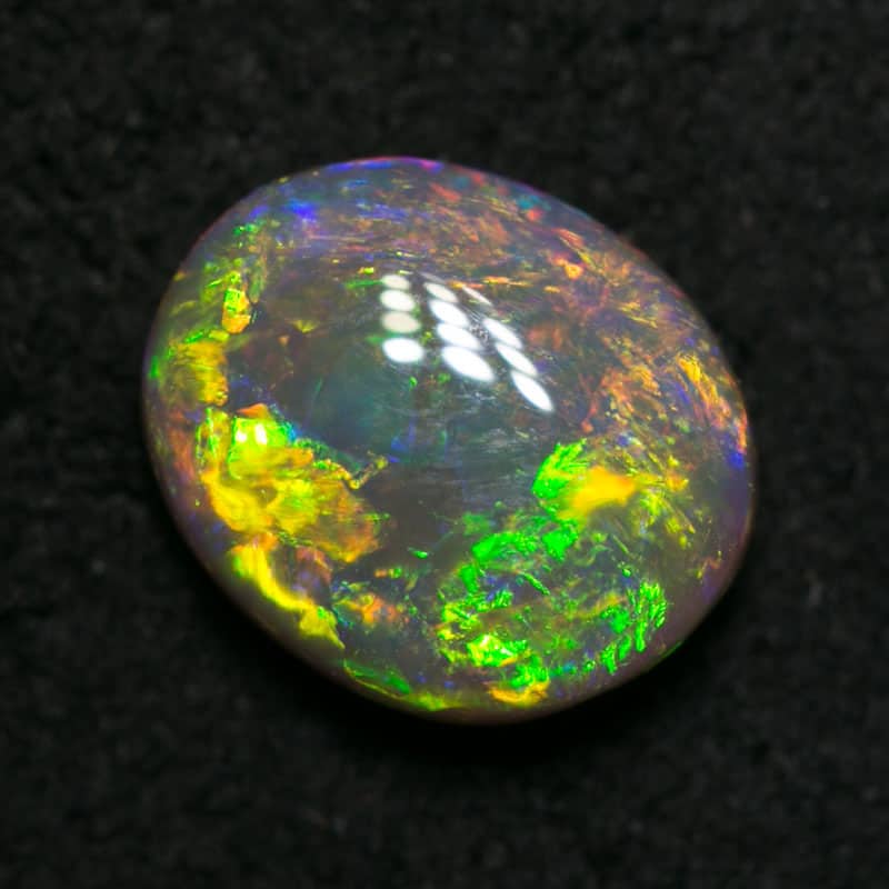 0.81 ct dark opal 7x6x3mm
