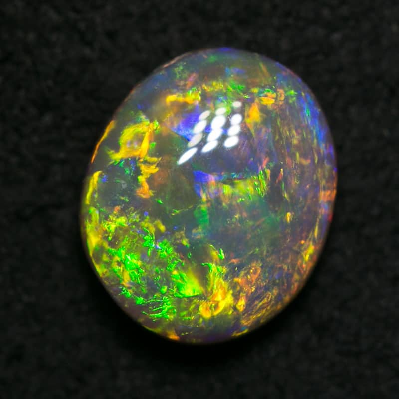 0.81 ct dark opal 7x6x3mm