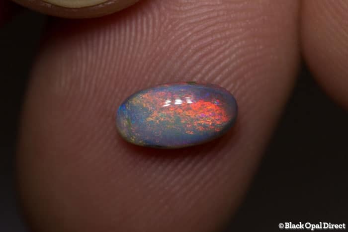 0.81 ct semi black opal 9x5x3mm