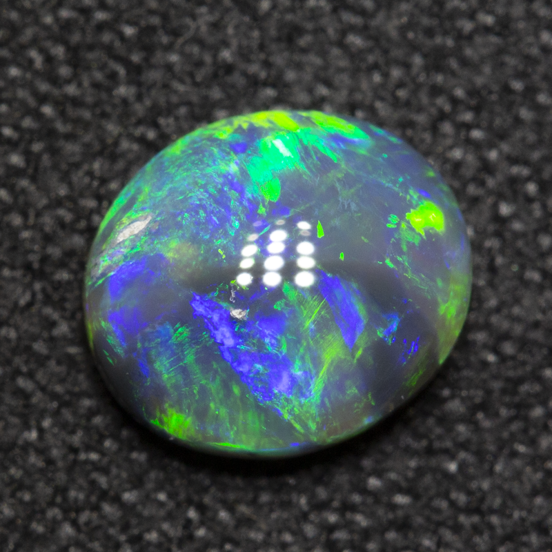 0.82 ct dark crystal opal 7x6.1x3mm